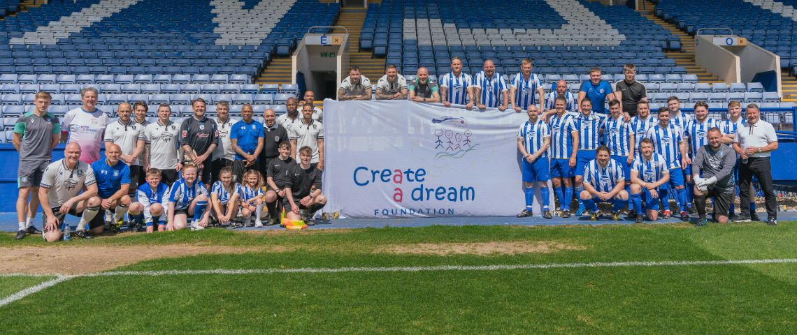 Create A Dream Foundation charity with Sheffield Wednesday Football Club players on the pitch